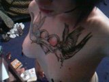 Punk-girl-showing-off-her-tattooed-tits