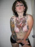 Punk-girl-with-multiple-tats-posing-naked