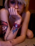Tattooed-and-pierced-cutie-shows-her-juggs
